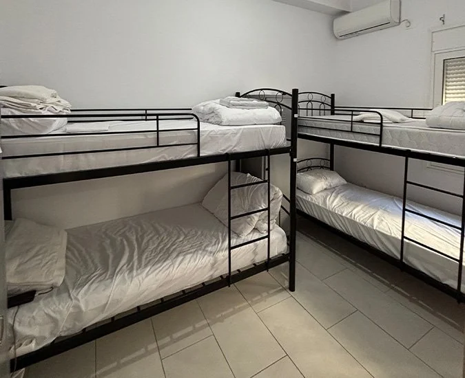 Shared dormitory room with bunk beds